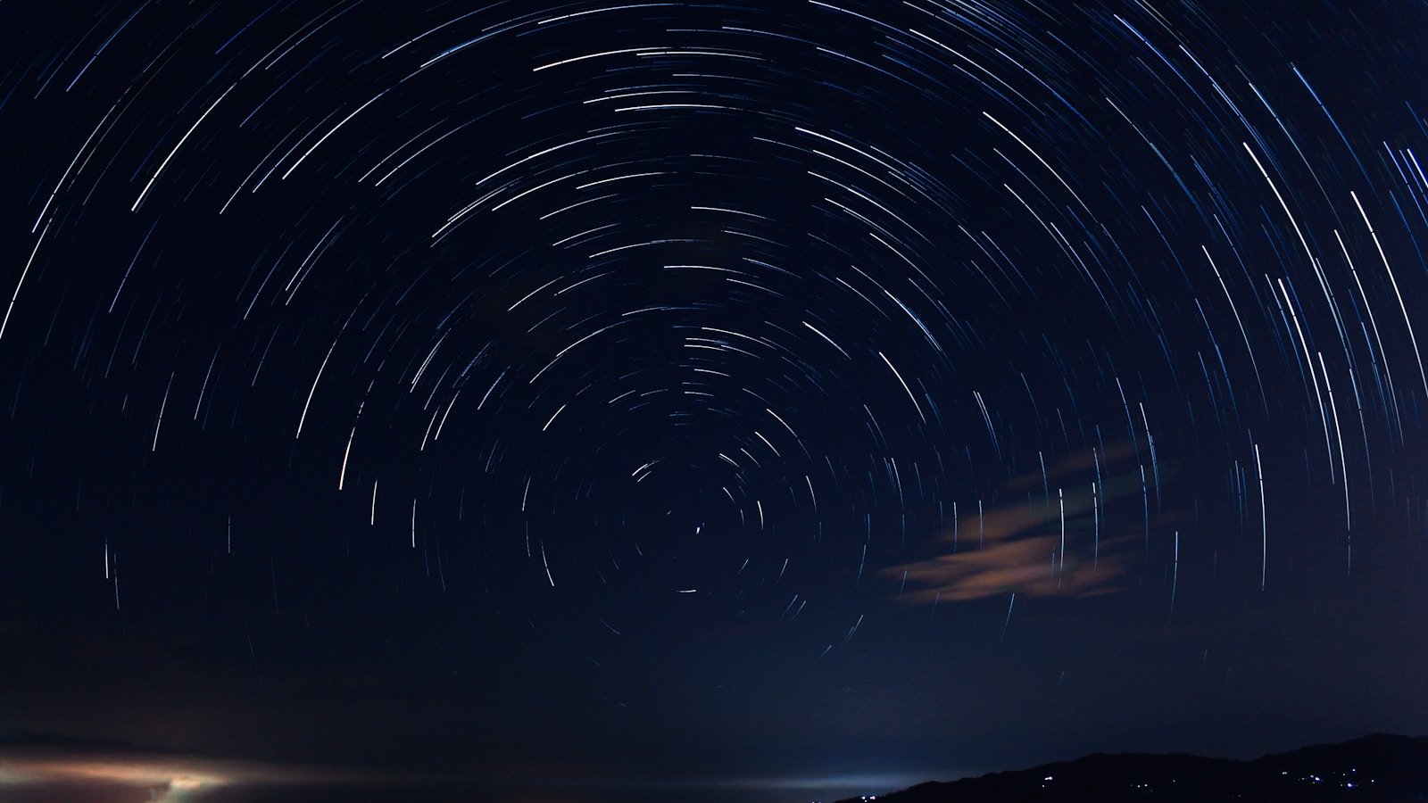 Close-up of the lunar terminator showing long shadows across craters and mountains